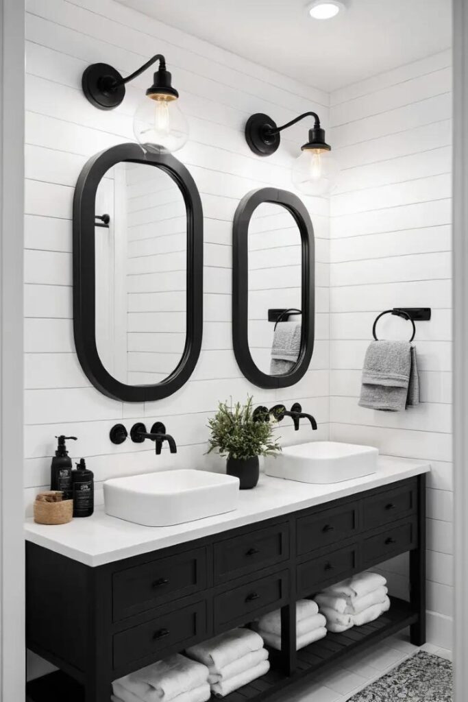A white shiplap bathroom with black accents for contrast and warmth.