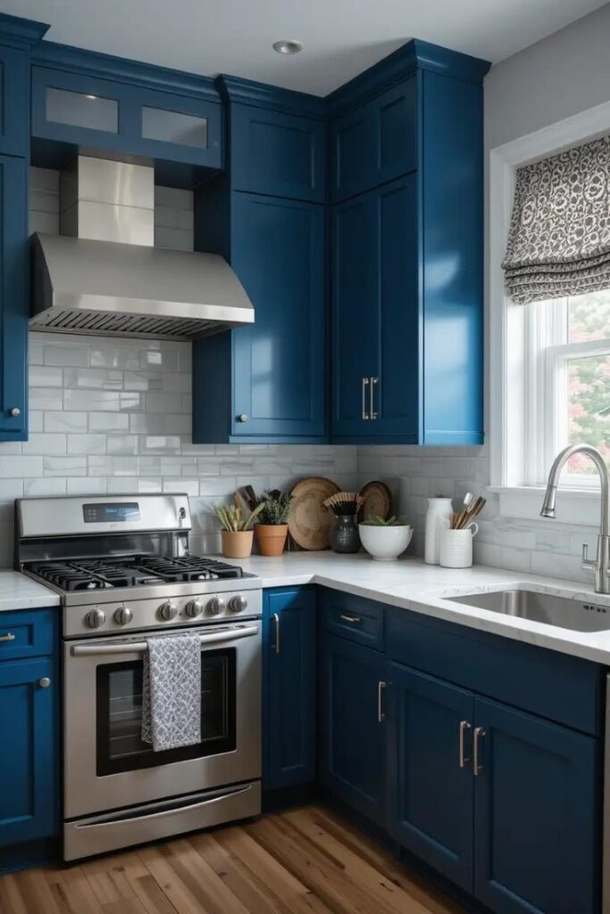 A contemporary kitchen with deep blue cabinetry and stainless steel finishes for a sleek look.