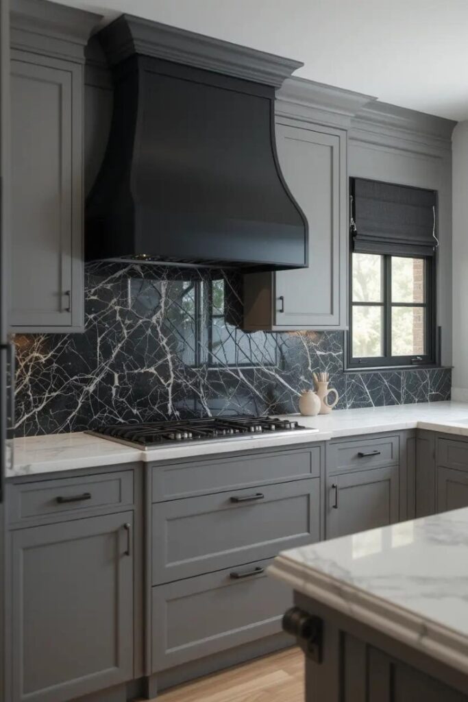 Chic gray kitchen with black accents providing dramatic contrast, including black lighting and fixtures for a bold yet balanced design.