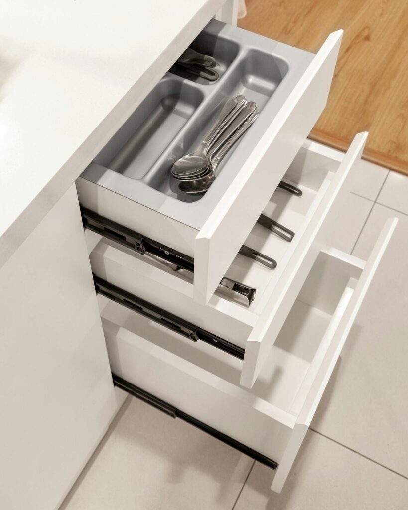 Organized deep kitchen drawer with dividers and neatly grouped items