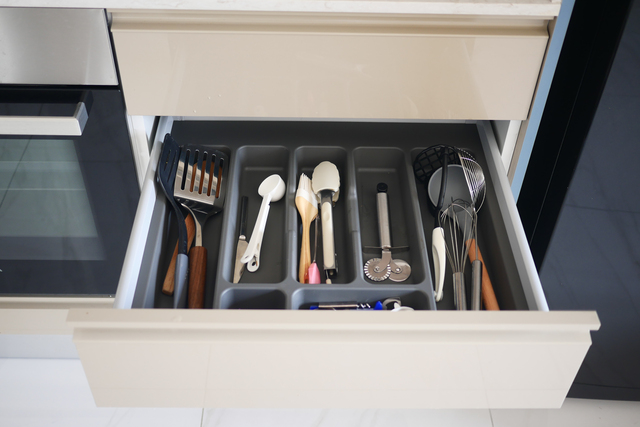 A WellOrganized Kitchen Utensil Drawer Featuring Essential Cooking Tools and Accessories