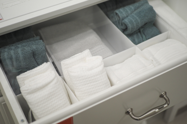 An Organized Bathroom Towel Drawer Featuring Freshly Folded Towels for Easy Access and Neatness