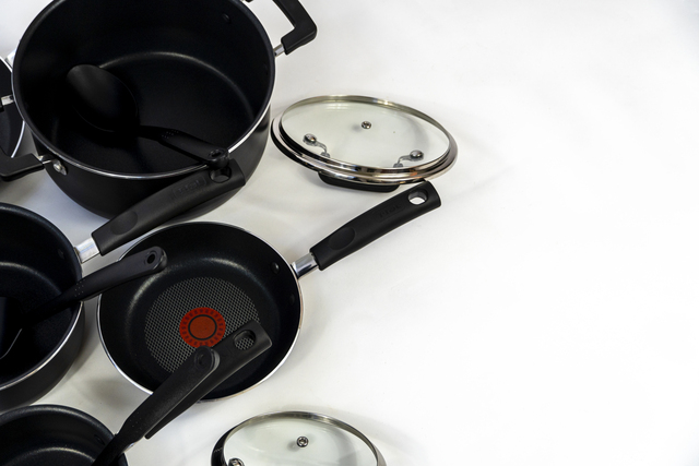 cookware set, steel dinner set isolated on white background, black metal cookware set